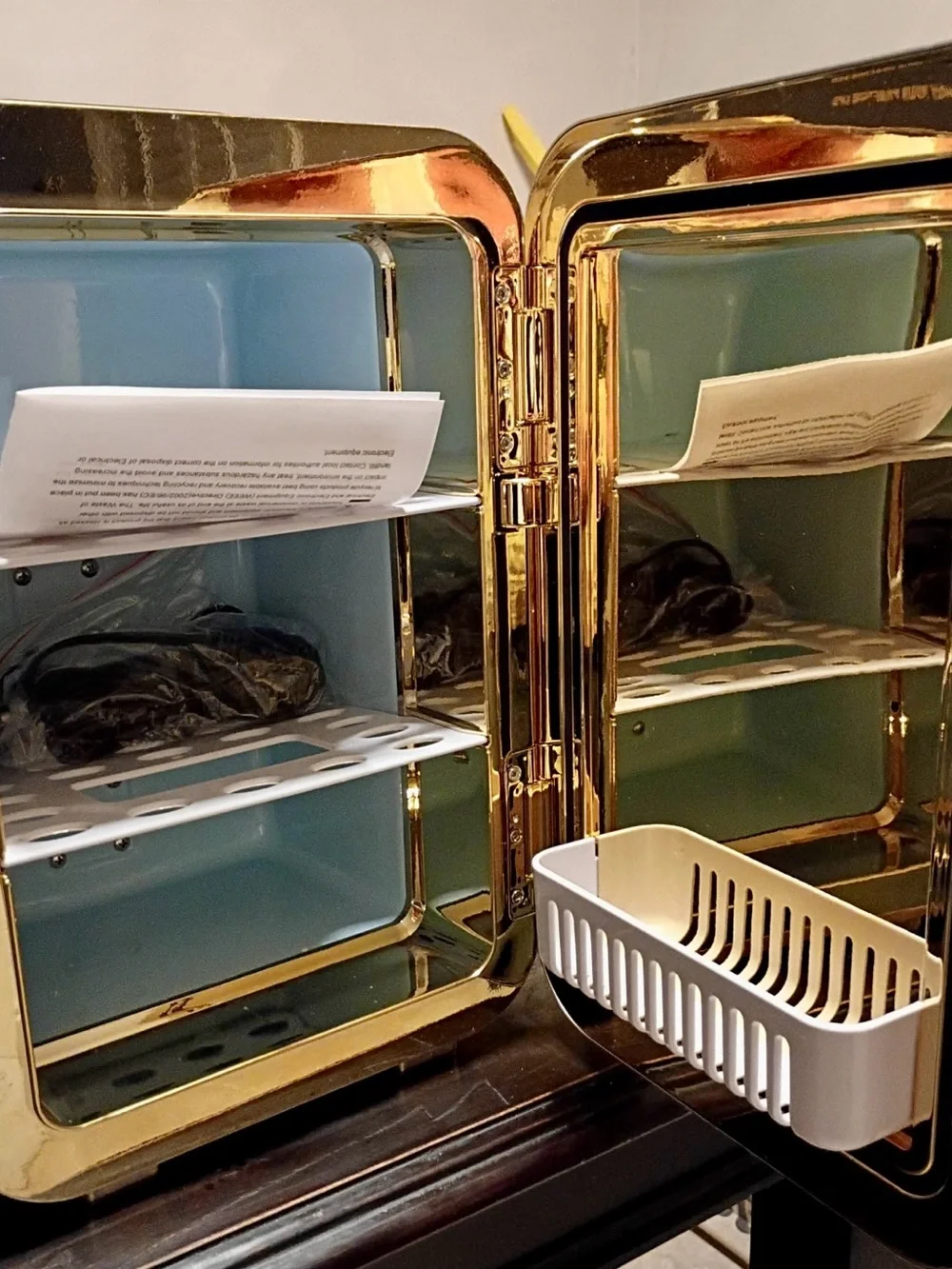 Gold Cosmetic Organizer Cabinet with Light Blue Interior and White Basket